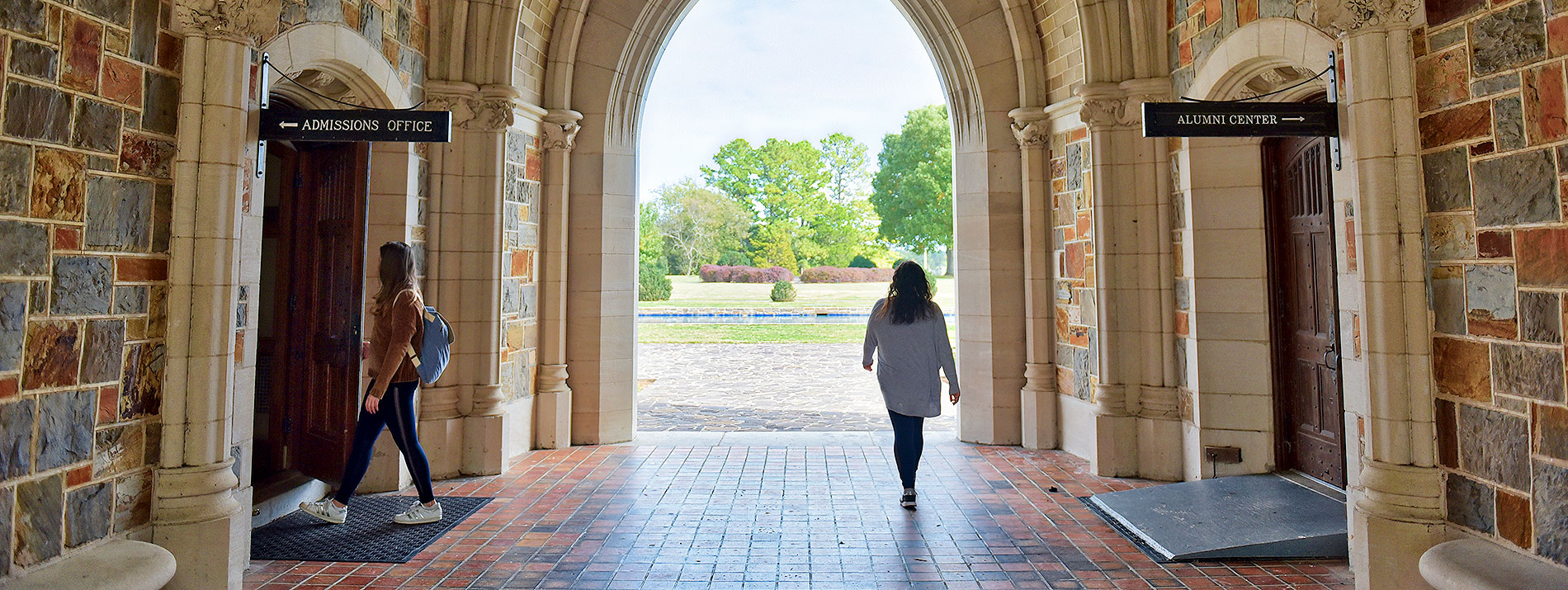 students walking in an archway