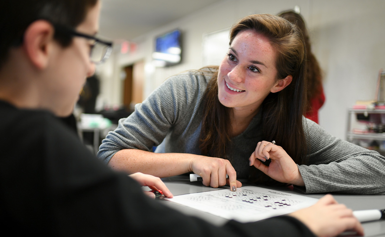 female mentor talking with male student