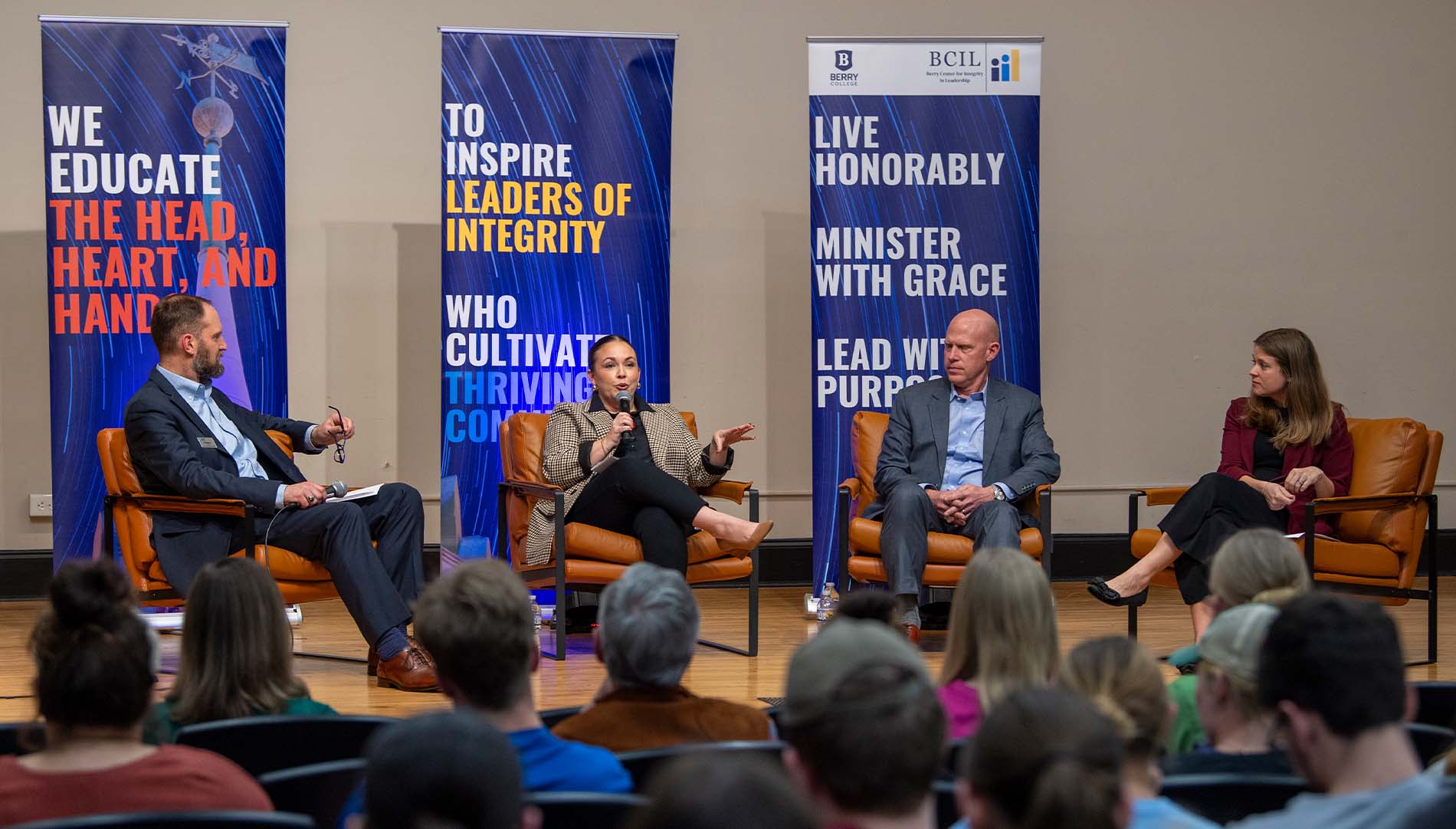 Panel of collegiate leadership on stage